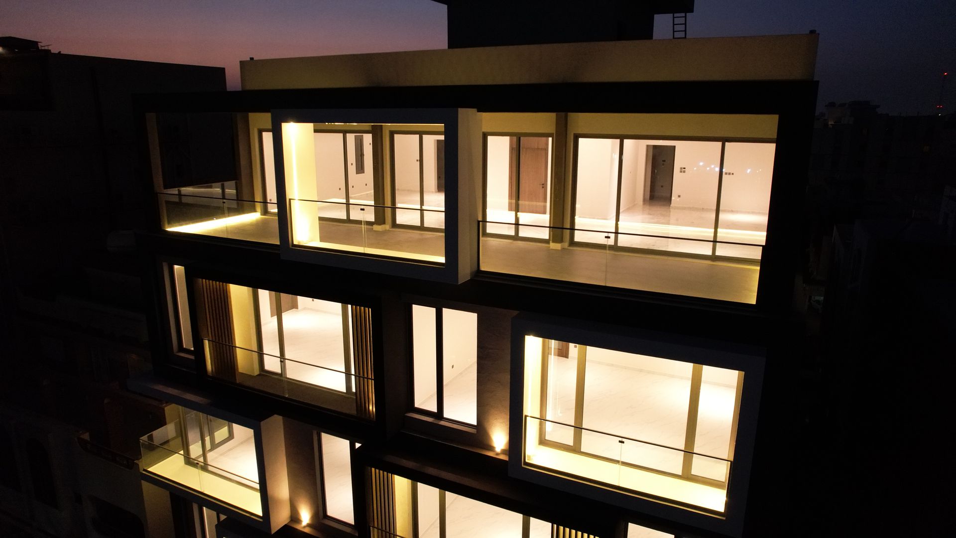 Façade at night — Al Zahra Residences