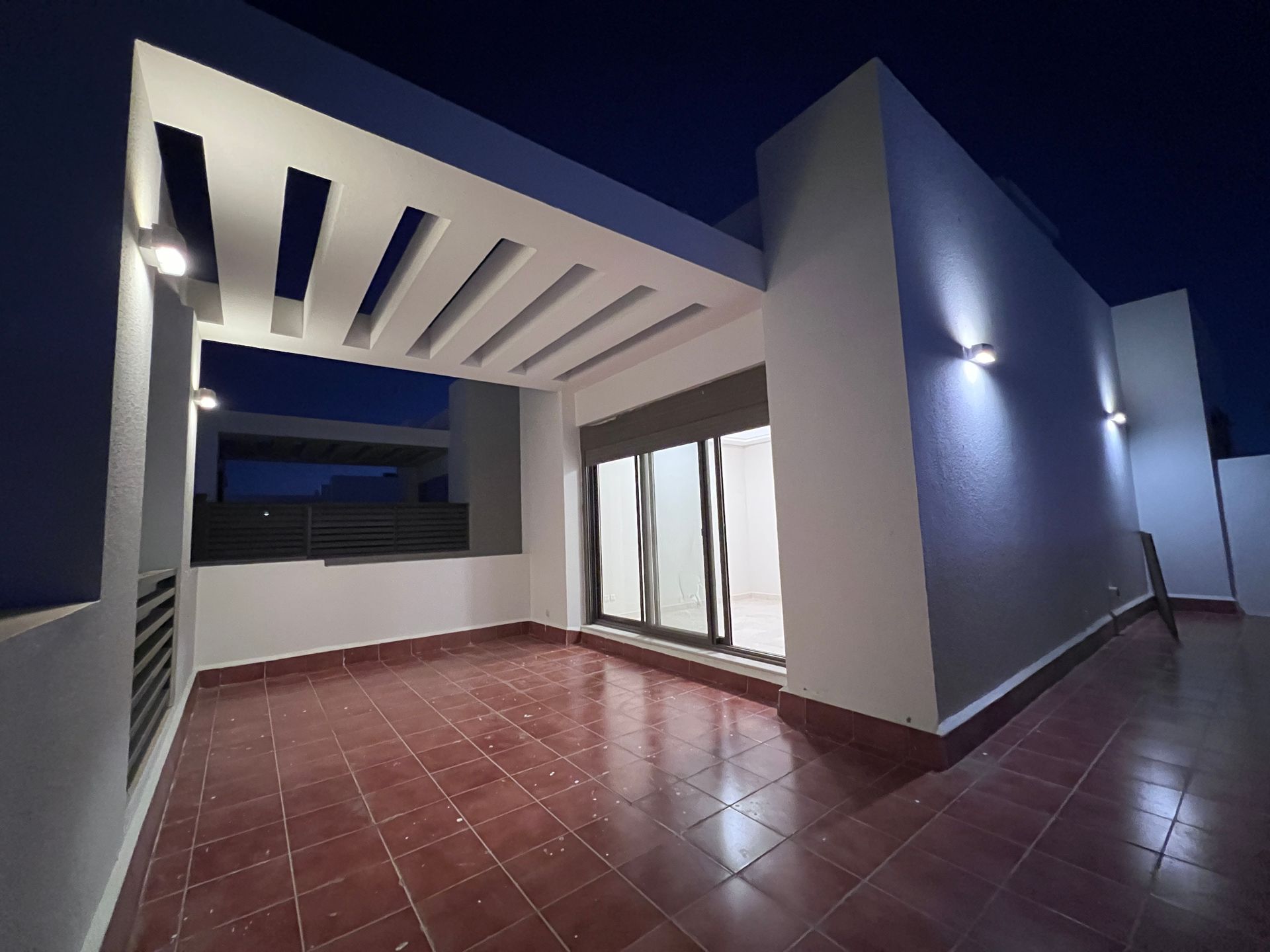 Façade at night — Park-Facing Villa, Al Khalidiyah