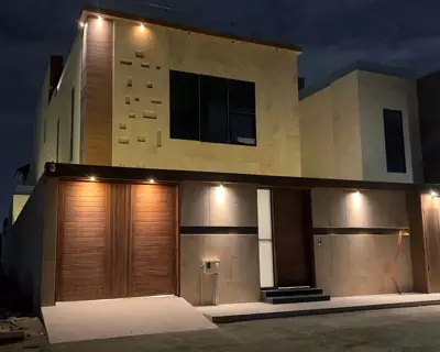 Façade at night — Timber-Detailed Villa, Al Mohammadiyah