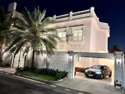 Façade at night — Villa Al Shati 1