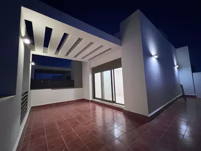 Façade at night — Park-Facing Villa, Al Khalidiyah
